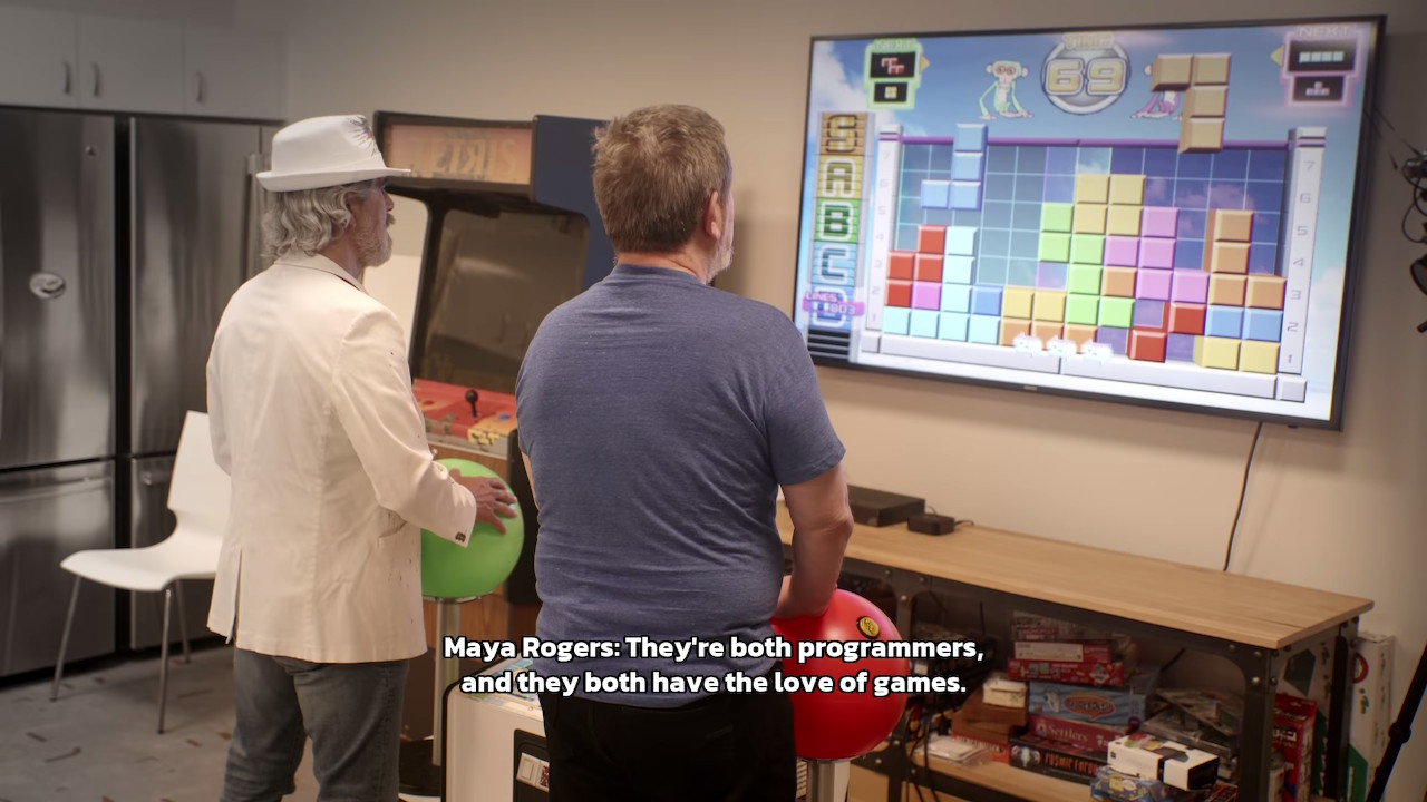 Screenshot from Tetris Forever: Alexey Pajitnov and Henk Rogers playing Tetris Giant together at the Tetris headquarters.